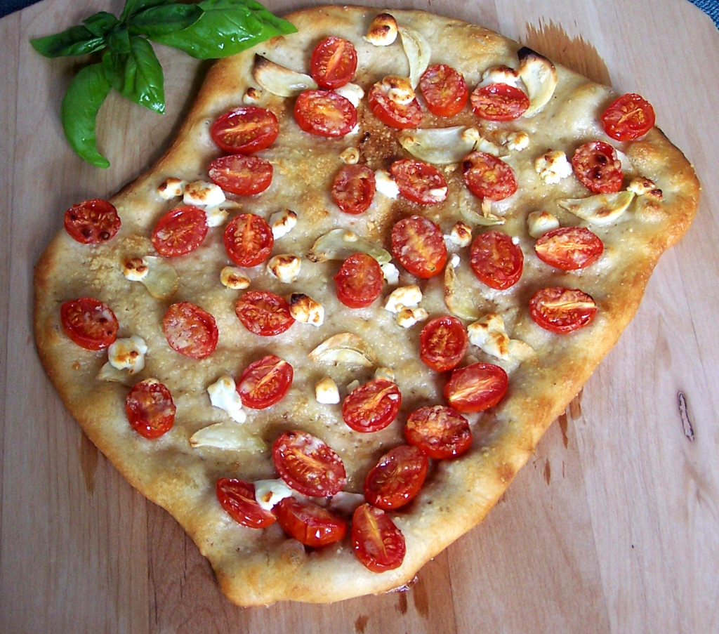cherry tomato garlic goat cheese and parmesan pizza