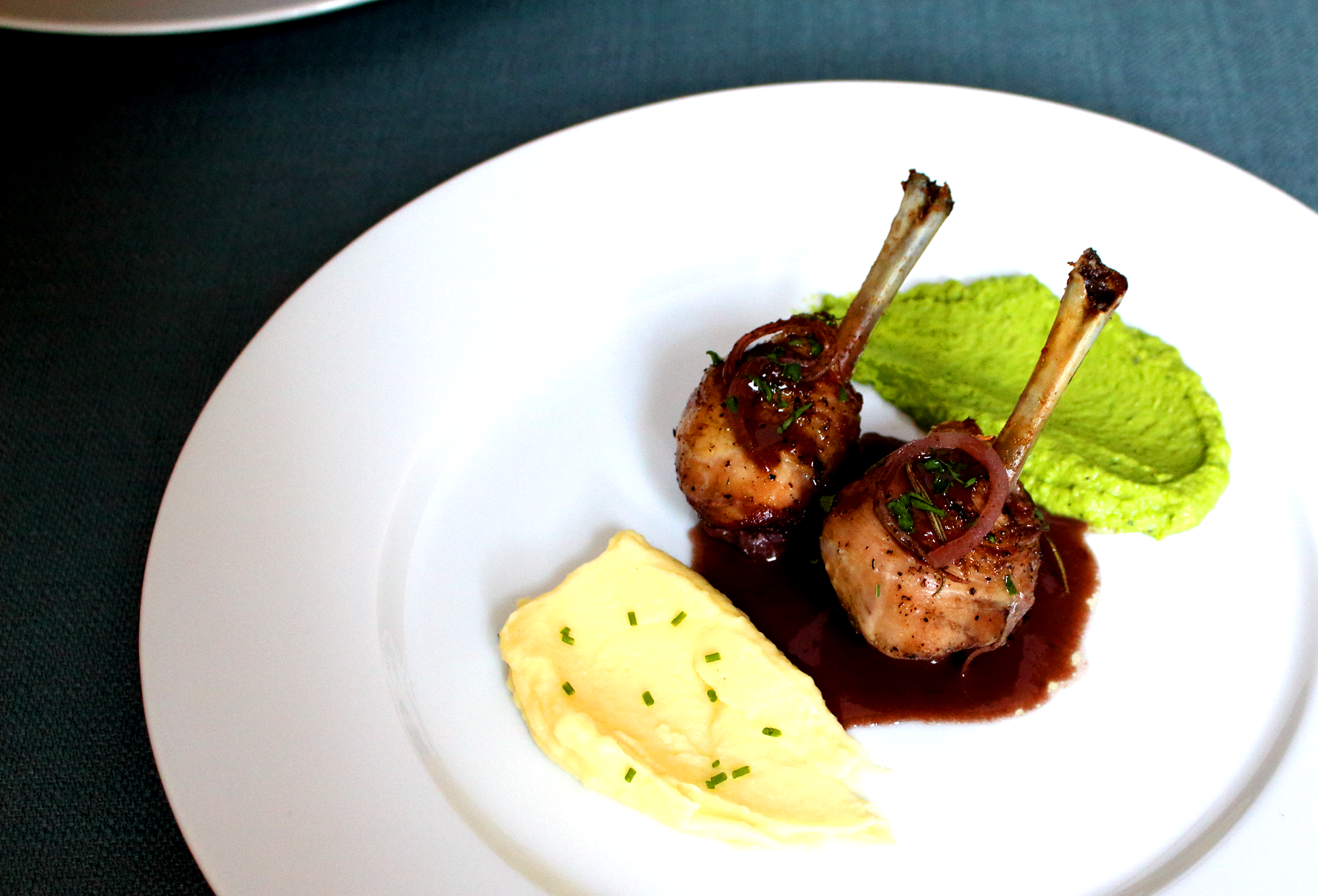 herb roasted chicken legs in red wine and madeira sauce
