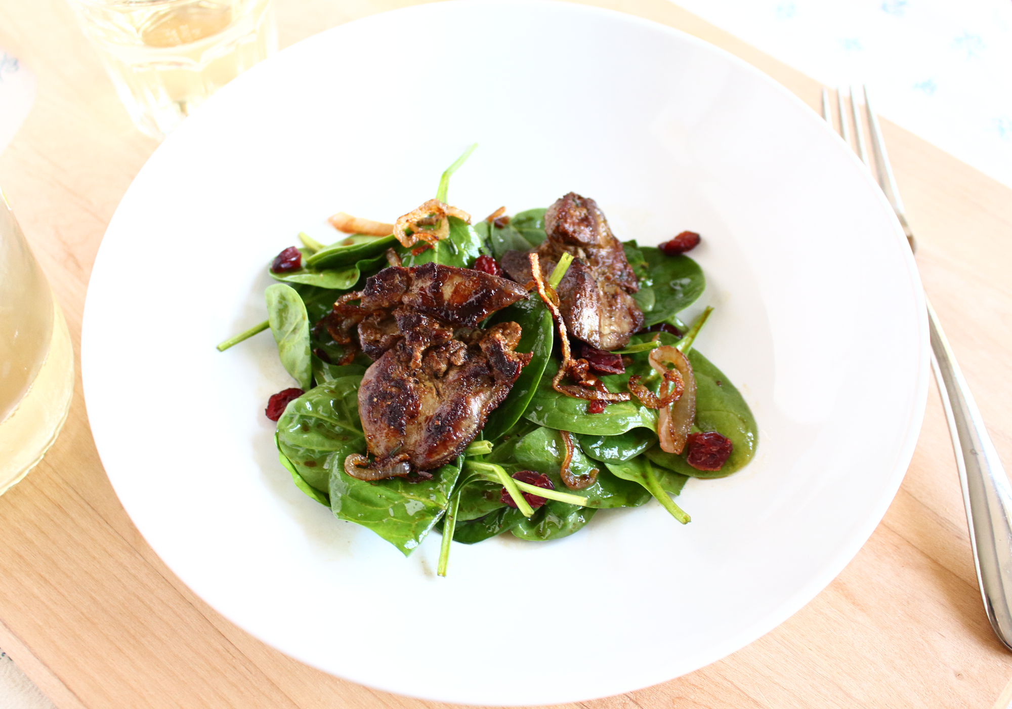 pan roasted chicken liver and spinach salad with shallots and dried cranberries